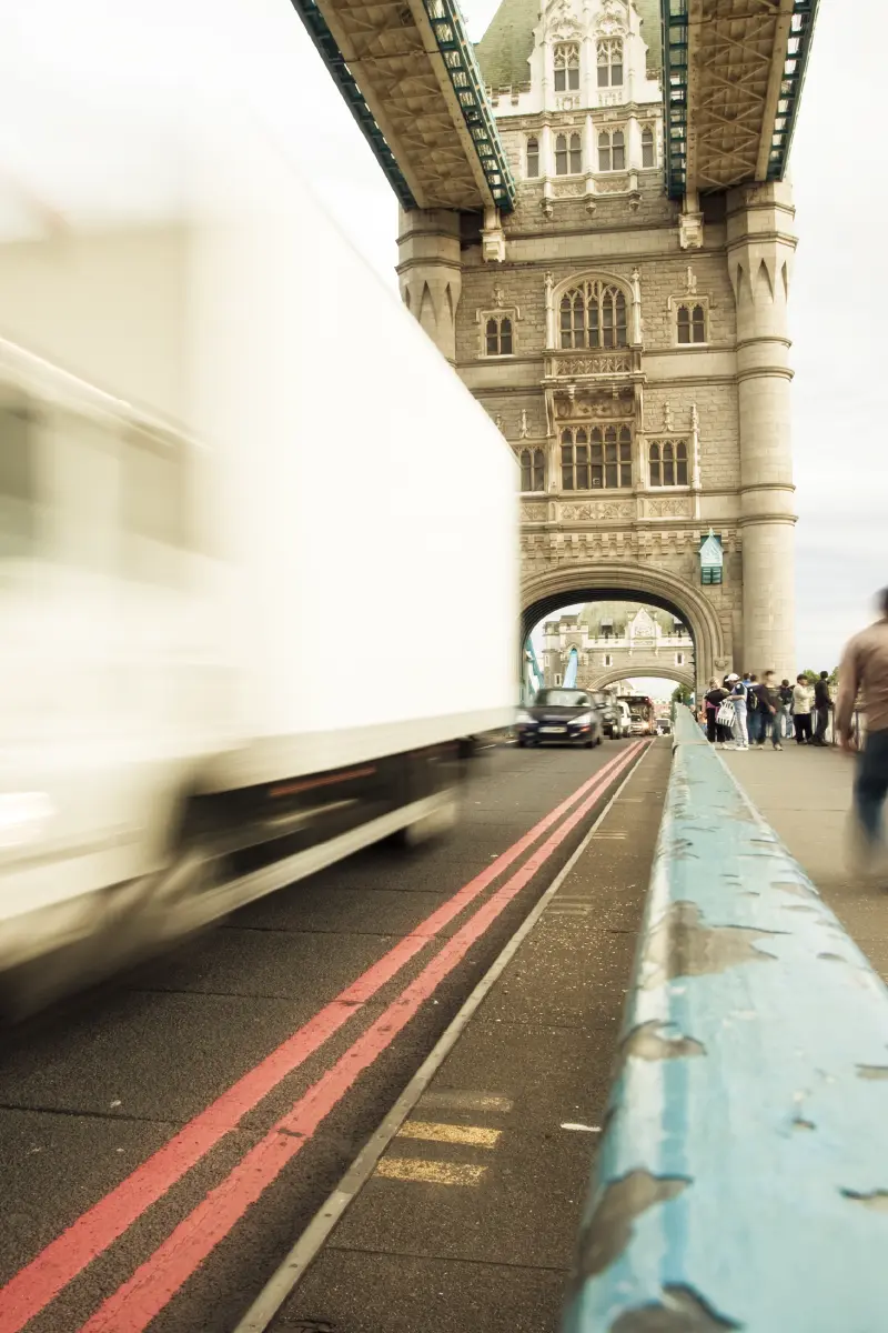 A cyclist in the blind spot of a truck.
